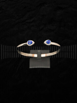 Pulseras Torques Oro Blanco con brillantes y zafiro azul