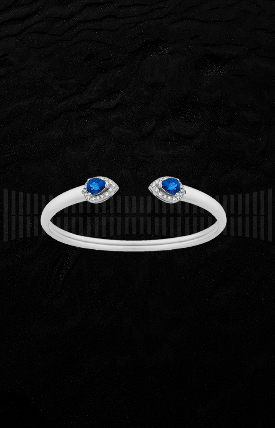 Brazalete de oro blanco de 1ª Ley con diamantes talla brillante y zafiros