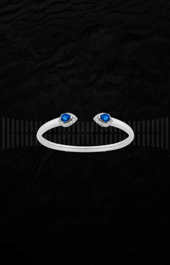 Brazalete de oro blanco de 1ª Ley con diamantes talla brillante y zafiros